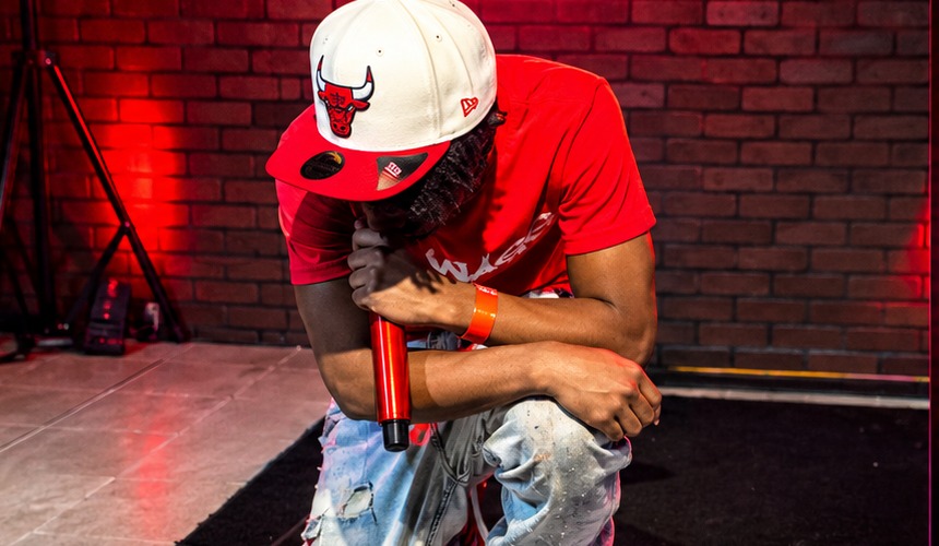 APSWAGG kneeling on stage